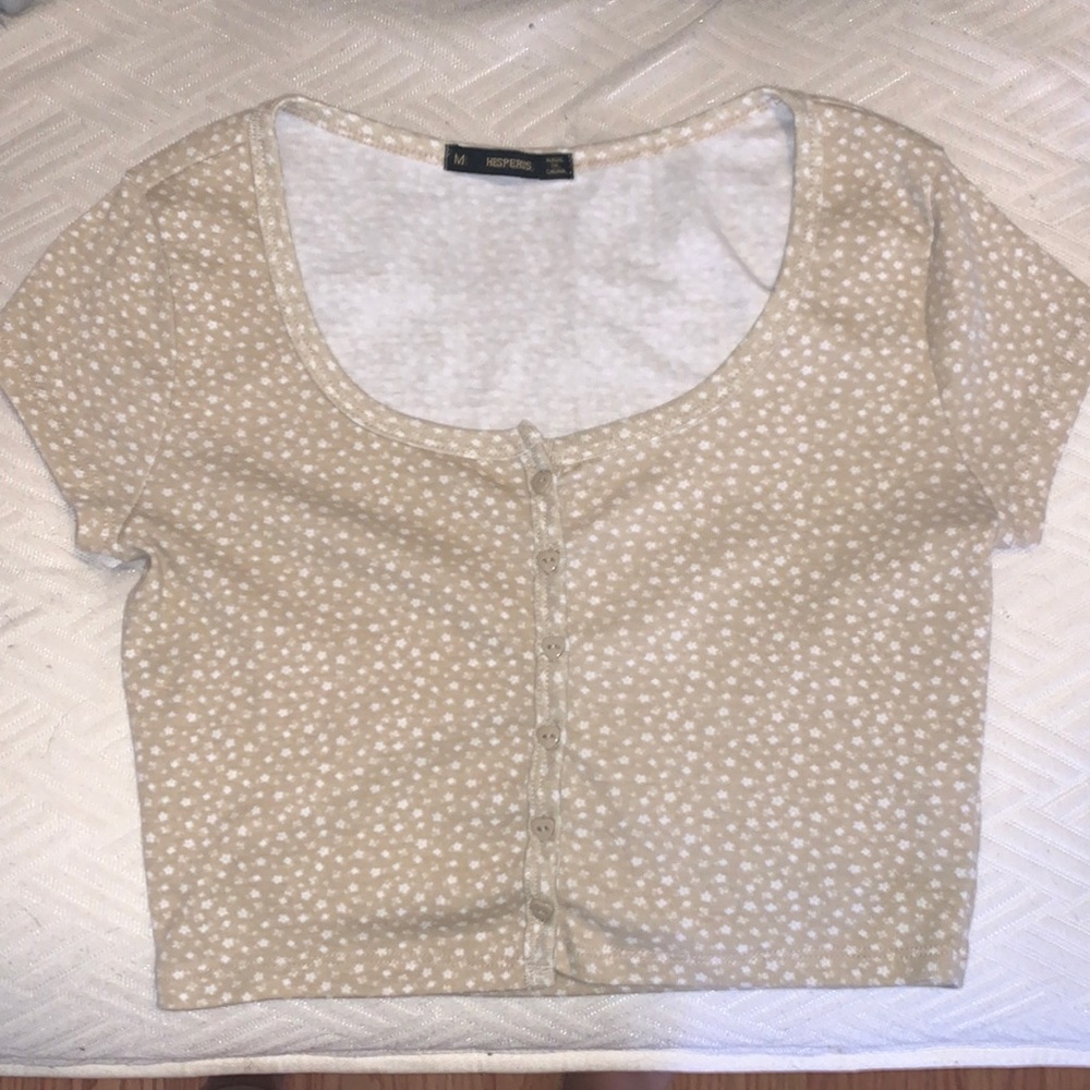 This is a kinda short cut shirt in the front but very comfortable and cute.